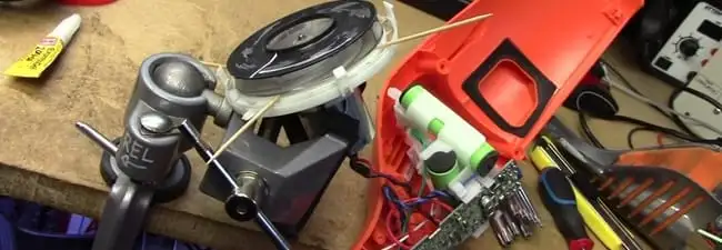 Vacuum cleaner repair parts and tools on a workbench in Worcester, MA